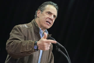 Former aide says Cuomo kissed her, suggested strip poker