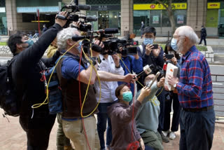 John Clancey, right, an American lawyer who became the first foreigner arrested under Hong Kong's national security law