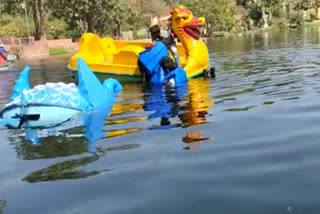 City development trust, boat overturns in pond