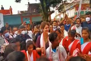 Priyanka Gandhi Vadra joins in the 'Jhumur' dance of performers from tea tribes, in Lakhimpur