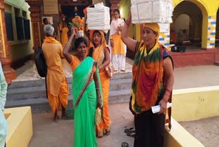 Members of Dantewada Gayatri Shaktipeeth are distributing Ganga water brought from Haridwar