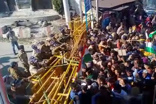 People pelted stones after police tried to stop protesters at a barrier in Diwali Khal area.