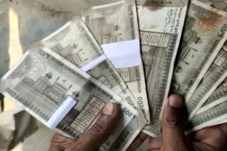 torn 500 notes out from ATM in morigaon