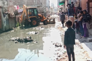 Cleaning of drains by installing JCB in Ramnagar and Chandan Vihar areas of Delhi
