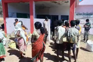 People standing at the ration shop