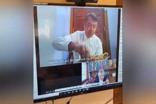 lawyer having meal while zoom call is alive