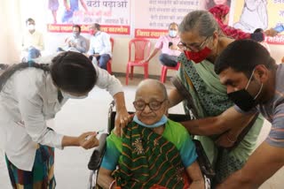 Elderly woman gets vaccinated in Khargone