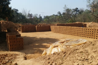 children of  working class are forced to work in brick-kiln