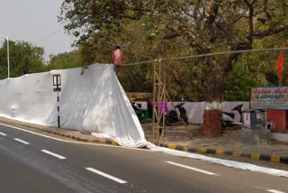 Ahead of PM Modi's visit, cloth wall to hide slums around Sabarmati Ashram in Ahmedabad
