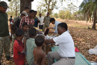 Bijapur Superintendent distributing stuffs