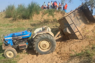 sand-laden tractor overturns in nalanda