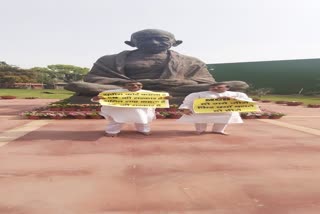 AAP MPs protest in front of Gandhi statue in Parliament