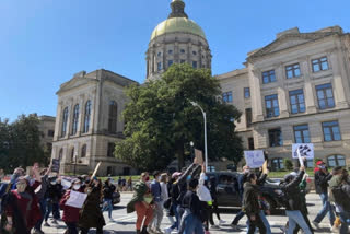 Hundreds in Atlanta rally against hate after spa shootings