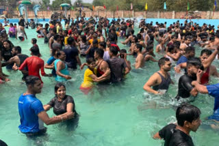 people are violating corona guidelines in water park in ghatshila