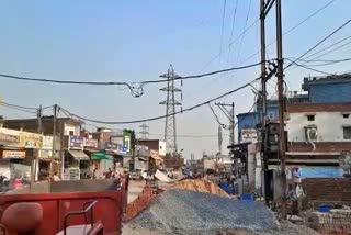 high voltage line passing near houses