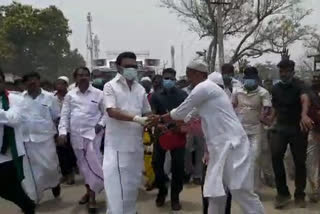 DMK leader Stalin walking down the street and collecting votes in vaaniyampadi
