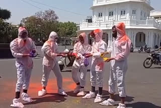 holi celebration with wearing PPE kit in ujjain