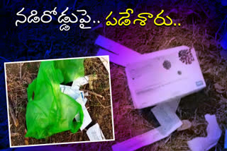 corona testing kits are thrown at main road in manthani