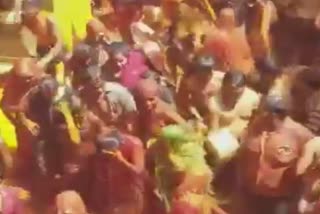 Devotees played 'Kapda Fad' Holi in the premises of Dauji Temple in Baldeo area of Mathura district