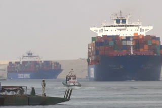 Suez Canal for third day