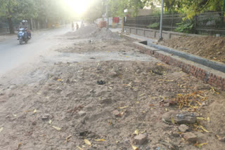 Debris dumped on the road during the construction of drain in Sadiq Nagar