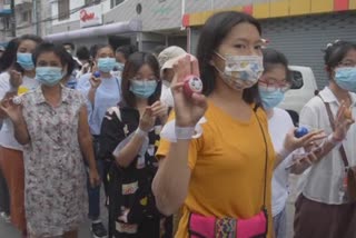 Myanmar protesters carry eggs in Sunday demo