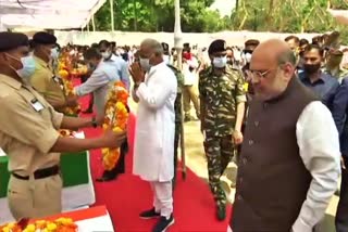 Amit Shah lay wreath at the coffins of security personnel who lost their lives in the Naxal attack