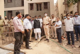 Imran Hussain with police and officers