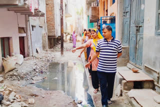 leakage of water from the illegally constructed toilet tank in  Sangam Vihar streets