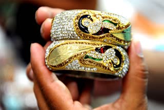 Gold rises by Rs 587 and silver by Rs 682