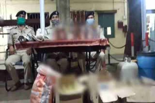 police raids on liquor factory in dhanbad