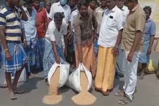 Farmers protest by pouring paddy on the road in Eesur