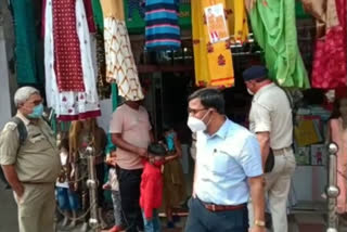 shops closed for not following corona guidelines in dhanbad
