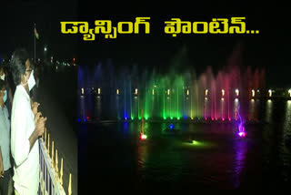 Minister Puvvada Ajay Kumar inspecting a dancing fountain at Lakaram Tank Bund in Khammam District