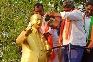 BJP leaders anoint to Ambedkar statue with river waters in Godavarikhani town of Peddapalli district