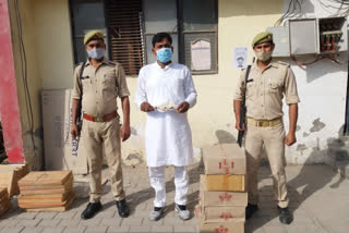 accused arrested for distributing liquor during election campaign in greater noida