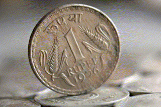 rupee gained 58 paise to end at rs 74.35 per dollar.