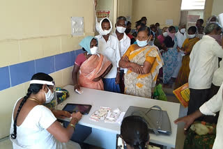 people rush at husnabad government hospital, vaccination in husnabad