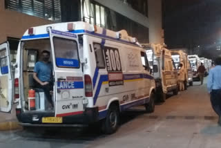 Queue Of Ambulances With COVID Patients