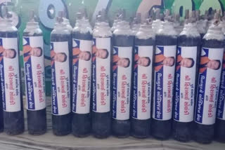 Oxygen Cylinder's for Covid patients with BJP leader poster