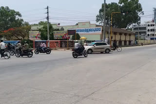 Vehicles on roads in between curfew at Chamarajnagar