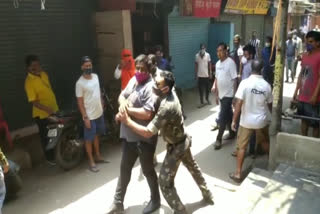 SHOPKEEPER SCUFFLE WITH POLICE FORCE