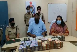 Police arrested two accused huge cash