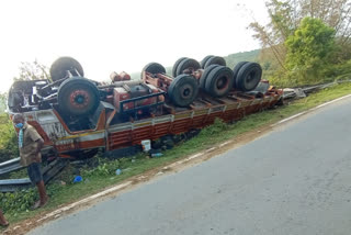 two truck overturns