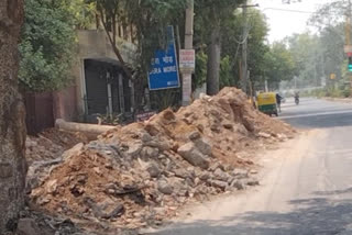 Debris piled near the main road of Dera Mor chhaterpur delhi