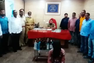 two arrested by dharavi police in fake liquor and drugs case