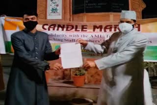 amu students hold candle march and memorandum to vice chancellor