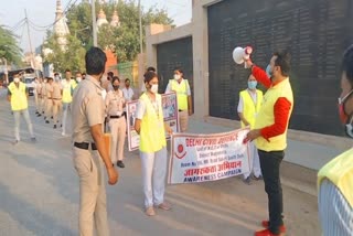 civil defense personnel run awareness campaign against corona