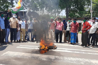 in arambagh tmc workers blocked the road and burning the tires