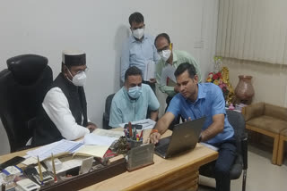 Medical Education Minister Vishwas Sarang discussing with officials
